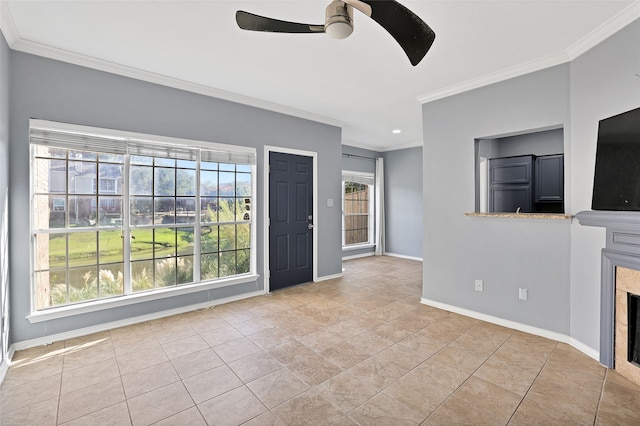 unfurnished living room featuring light tile patterned flooring, plenty of natural light, ornamental molding, and ceiling fan