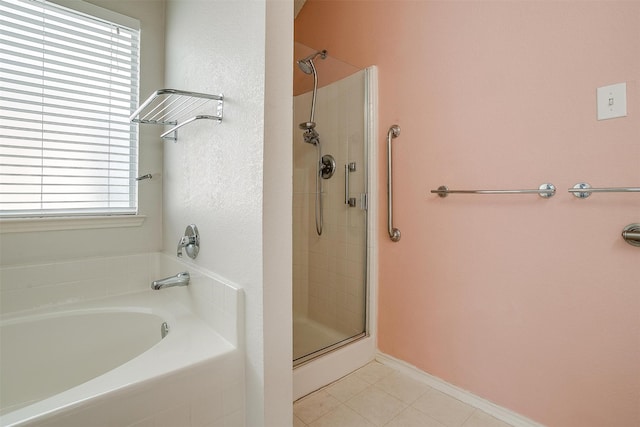 bathroom featuring independent shower and bath, tile patterned floors, and plenty of natural light