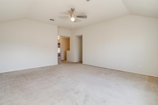 carpeted empty room featuring lofted ceiling and ceiling fan