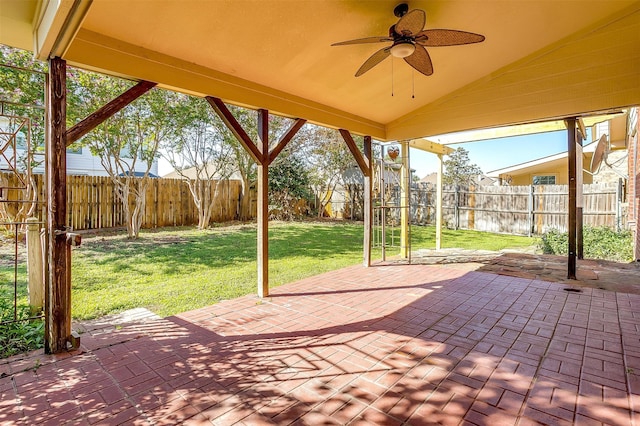 view of patio featuring a water view and ceiling fan