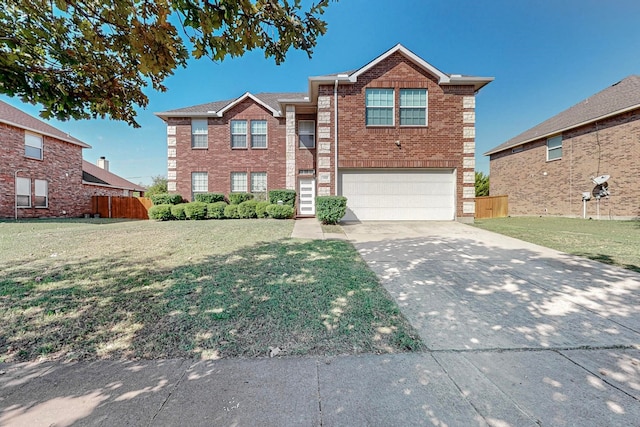 view of front facade with a garage and a front lawn