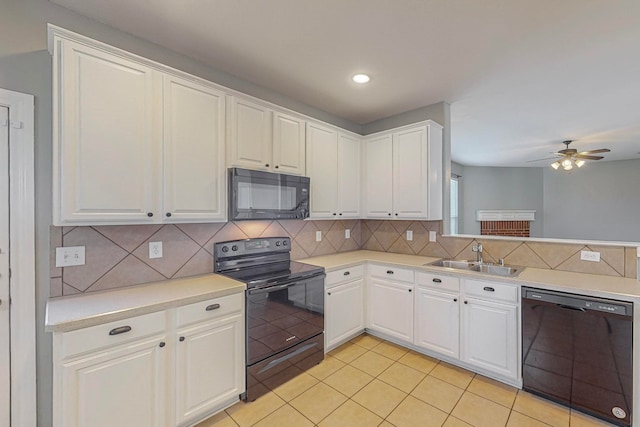 kitchen featuring white cabinets, black appliances, ceiling fan, and sink