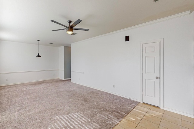 carpeted empty room with crown molding and ceiling fan