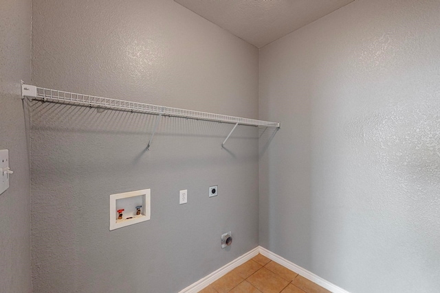 laundry room with washer hookup, tile patterned flooring, and electric dryer hookup