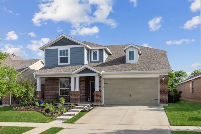 view of front of home featuring a front yard and a garage