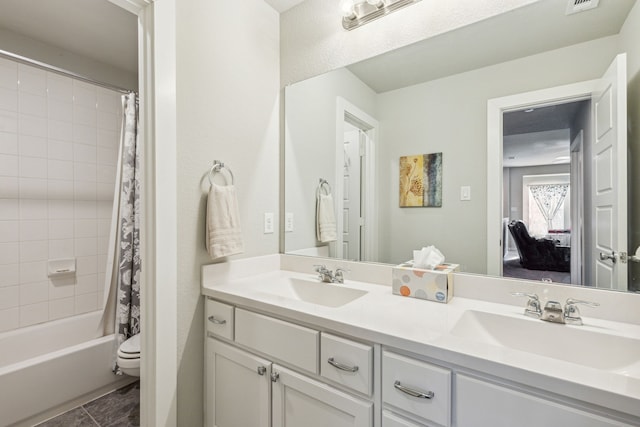 full bathroom featuring vanity, toilet, tile patterned floors, and shower / bath combo with shower curtain