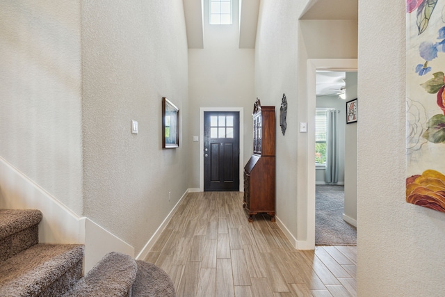 dining room with light hardwood / wood-style flooring and a chandelier