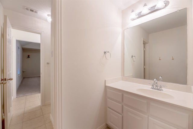 bathroom with tile patterned floors and vanity