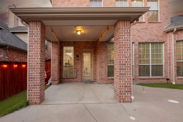 property entrance featuring a patio