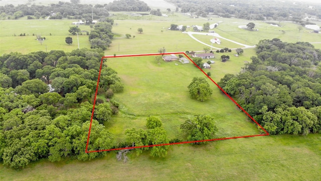 birds eye view of property featuring a rural view