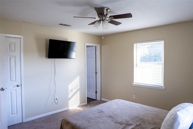 carpeted bedroom with ceiling fan