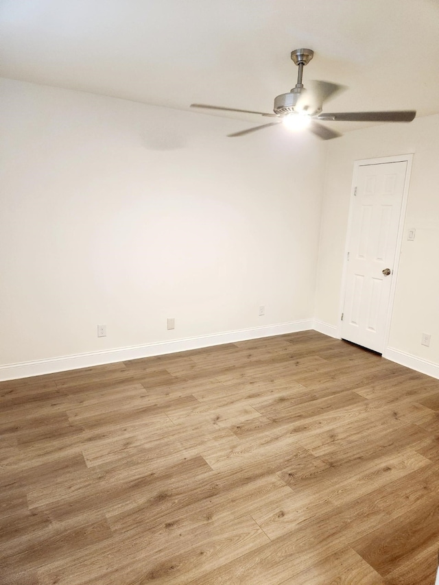 unfurnished room featuring hardwood / wood-style flooring and ceiling fan