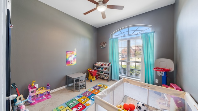 playroom with ceiling fan and carpet floors