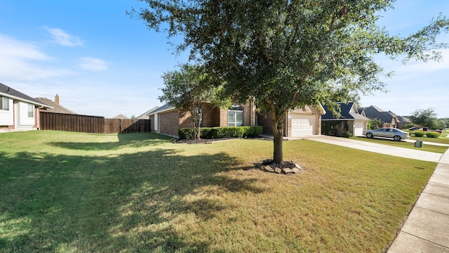 view of front of property with a garage and a front yard