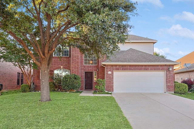 view of front of house featuring a front yard and a garage