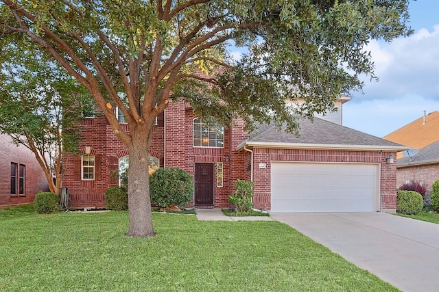 view of front facade featuring a garage and a front lawn