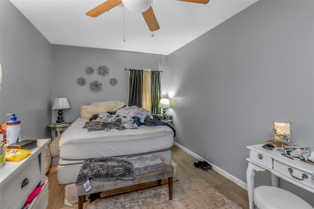 bedroom with ceiling fan and light wood-type flooring