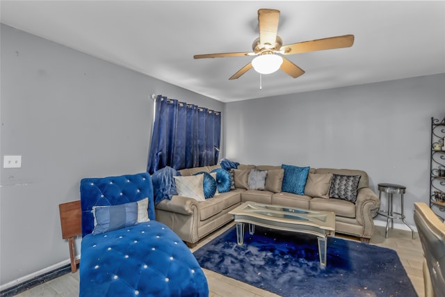 living room with light hardwood / wood-style floors and ceiling fan