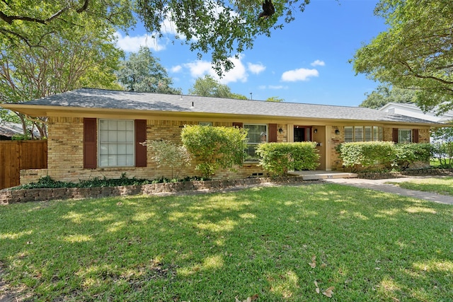 single story home featuring a front yard