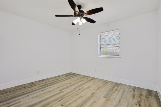 empty room featuring light wood-type flooring and ceiling fan