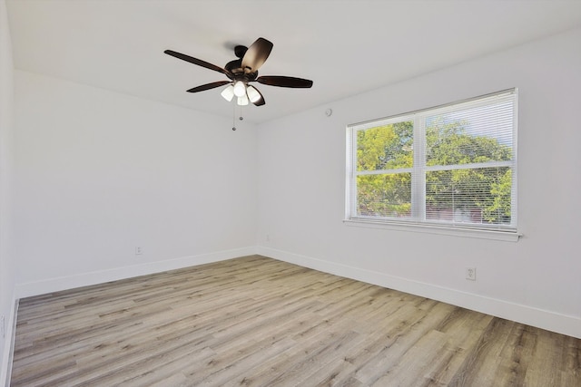 empty room featuring light hardwood / wood-style flooring and ceiling fan