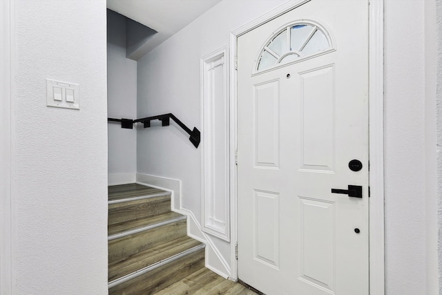 foyer entrance featuring wood-type flooring