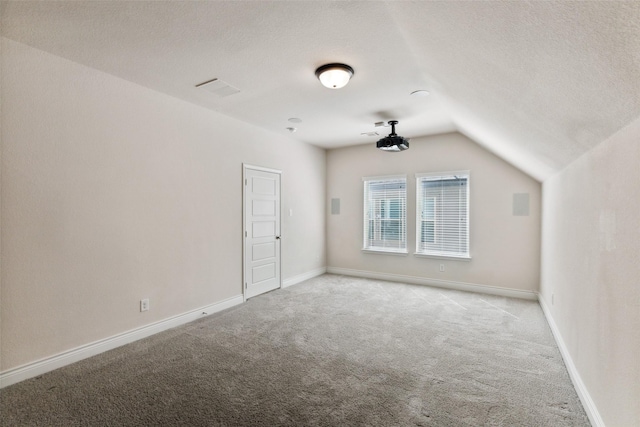 3705 Birch Wood Ct, Northlake, TX 76226 - additional living space with light carpet, a textured ceiling, and lofted ceiling