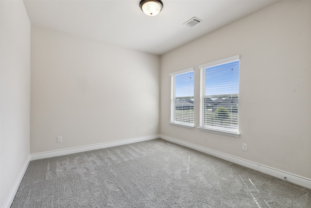 unfurnished room with carpet flooring