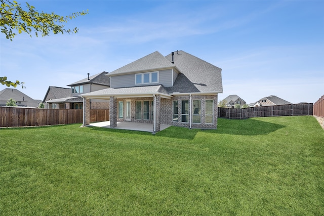 back of property with a patio and a lawn