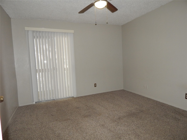 unfurnished room featuring a textured ceiling, carpet floors, and ceiling fan