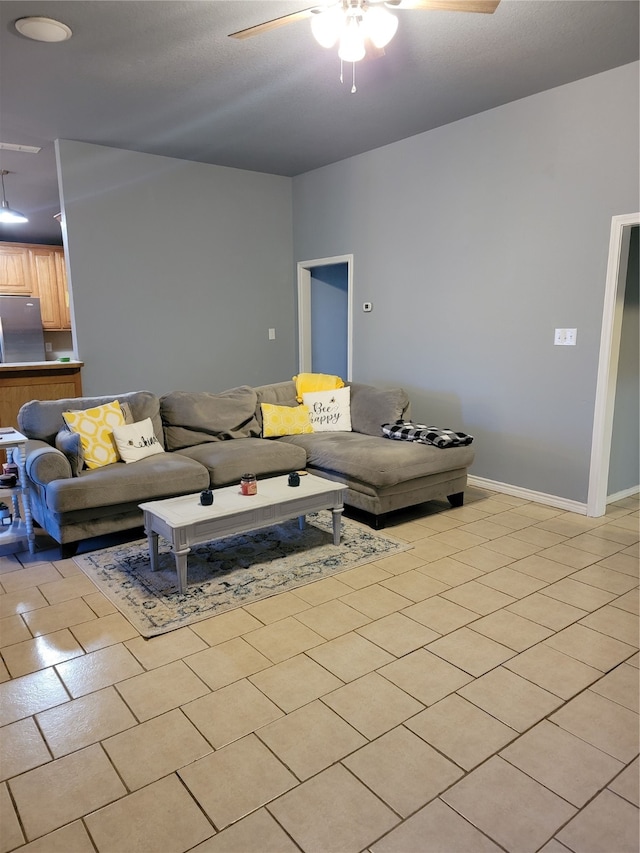 tiled living room featuring ceiling fan