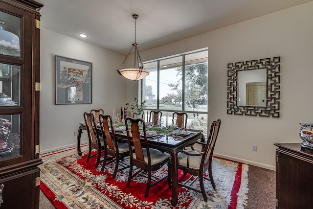 view of carpeted dining area