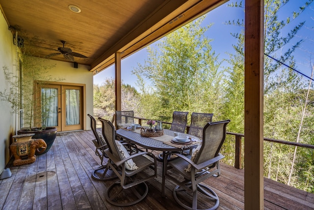 wooden deck with ceiling fan and french doors