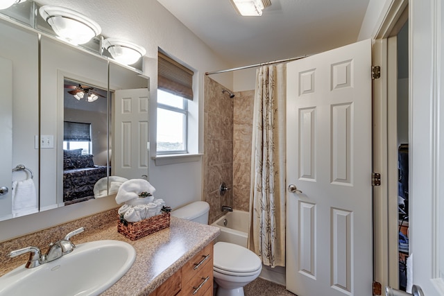 full bathroom featuring toilet, vanity, and shower / tub combo with curtain