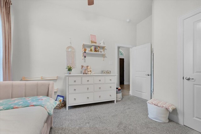 bedroom with light carpet, lofted ceiling, and ceiling fan