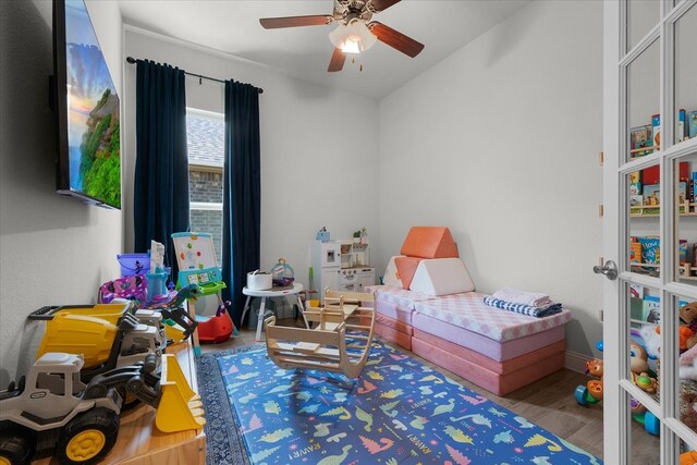 bedroom with ceiling fan and wood-type flooring