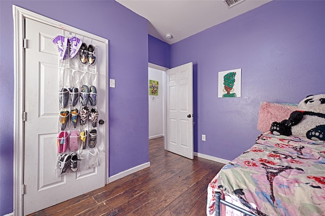 bedroom featuring dark wood-type flooring