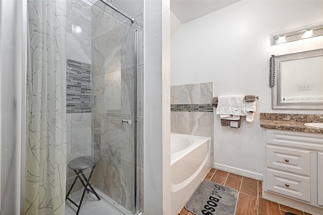 bathroom featuring vanity and separate shower and tub