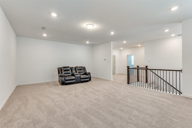 sitting room featuring light carpet