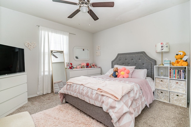 bedroom with ceiling fan and light carpet