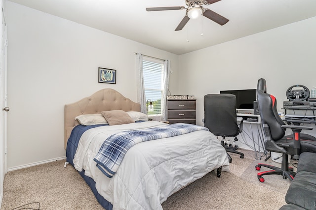 bedroom featuring ceiling fan and light colored carpet