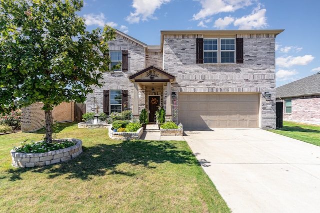 view of front of property featuring a front yard and a garage