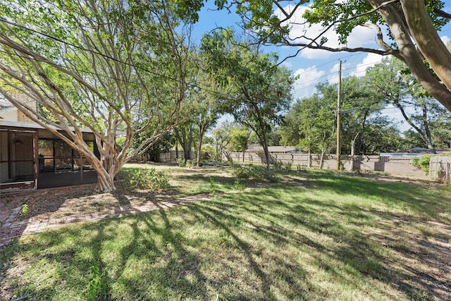 view of yard with a sunroom