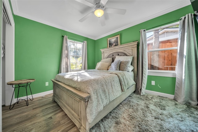 bedroom with multiple windows, ceiling fan, dark hardwood / wood-style floors, and crown molding