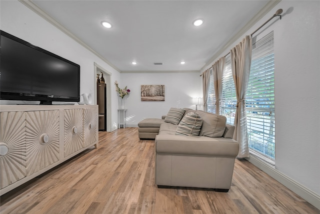 living room with crown molding and hardwood / wood-style floors