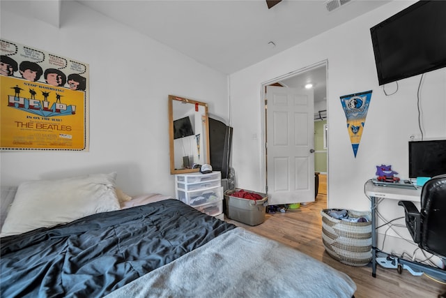 bedroom with wood-type flooring