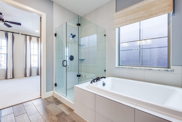 bathroom featuring independent shower and bath and ceiling fan