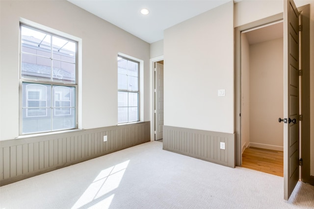 carpeted bedroom featuring a closet and radiator heating unit