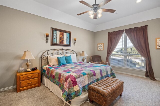 bedroom featuring ceiling fan and light colored carpet