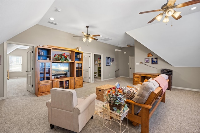 carpeted living room featuring ceiling fan and vaulted ceiling